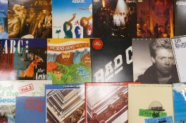 A collection of 1980's & earlier Lp's & 12" to include: Abba, Beach Boys, Byrds, ACDC, Dire Straits,