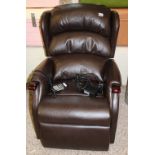 A 'Celebrity' branded recliner/riser armchair: in chocolate brown leather finish.