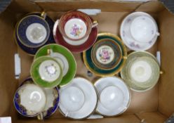 A collection of German floral and gild decorated small cups & saucers: (9)