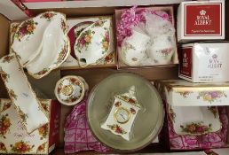 A collection of Royal Albert Old Country Roses patterned items: including vases, small mantel clock,