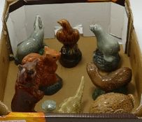 A collection of Beswick Whiskey flasks: to include badger, seal, loch ness, haggis bird etc. Four