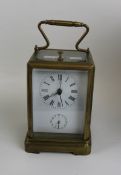 Quality brass carriage clock: overall height 19cm.