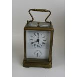 Quality brass carriage clock: overall height 19cm.