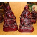 Two vintage red resin oriental figures depicting elders: 19cm tall (2).