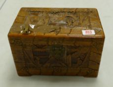 Carved wooden box: with oriental scenes 30cm x 18cm x 18cm