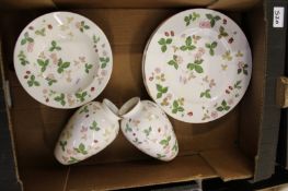 A collection of Wedgwood Wild Strawberry items: dinner plates, rimmed soup bowls etc.