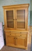 Modern, good quality honey oak display cabinet: with glass shelves and lights to the interior, (