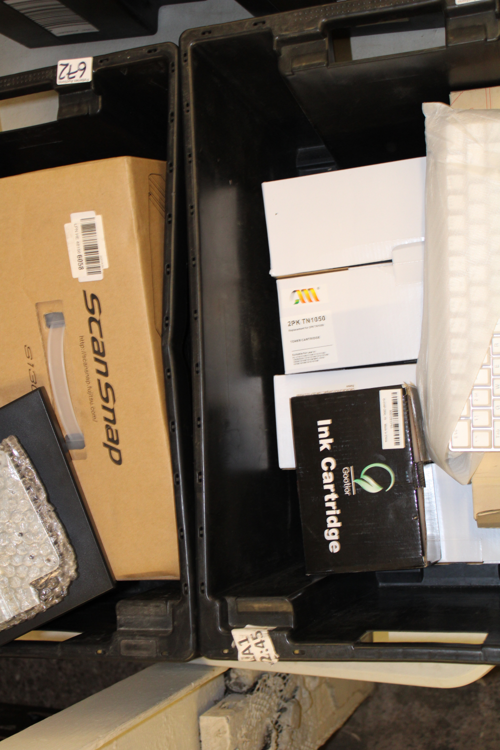 A collection of Amazon returned items including: computing items, keyboards, toner, scanner etc (2