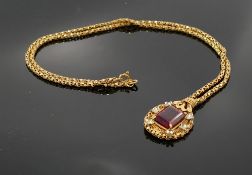 18ct gold set large ruby pendant and 18ct gold chain: Ruby submitted by vendor as genuine by repute,