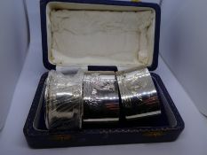 Pair of silver napkin rings and one other, all hallmarked  and of recent manufacture in an assorted