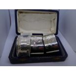 Pair of silver napkin rings and one other, all hallmarked  and of recent manufacture in an assorted