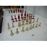 19th Century ivory chess set, some damaged and a replacement red queen