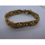 18ct yellow gold bracelet marked 750 with safety chain, weight 27.7g