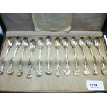 Set of white metal teaspoons each with different flower detailing to handle, stamped HH