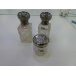 A pair of Edwardian silver topped rectangular cut glass scent bottles AF hallmarked London 1906, sli