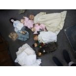 8 Vintage dolls, all in vintage clothes, and a quantity of christening gowns and other antique linen