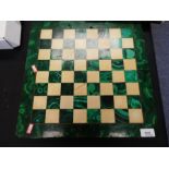 Hardstone green and cream chess board and a set of chess pieces
