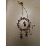 Pretty Victorian circular floral design pendant set with seed pearls and amethyst. marked 9ct in a b