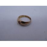 9ct Rose gold ring set with a red stone, size Q, marked 9, approx 3.7g