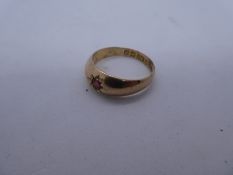 9ct Rose gold ring set with a red stone, size Q, marked 9, approx 3.7g