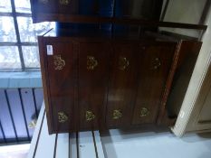 Small mahogany chest of 4 small drawers with brass pulls and a matching two drawer bedside table