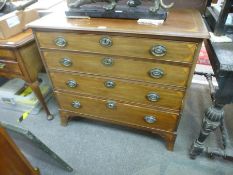 A 19th Century mahogany chest having four graduated drawers with fan inlaid decoration on splay brac