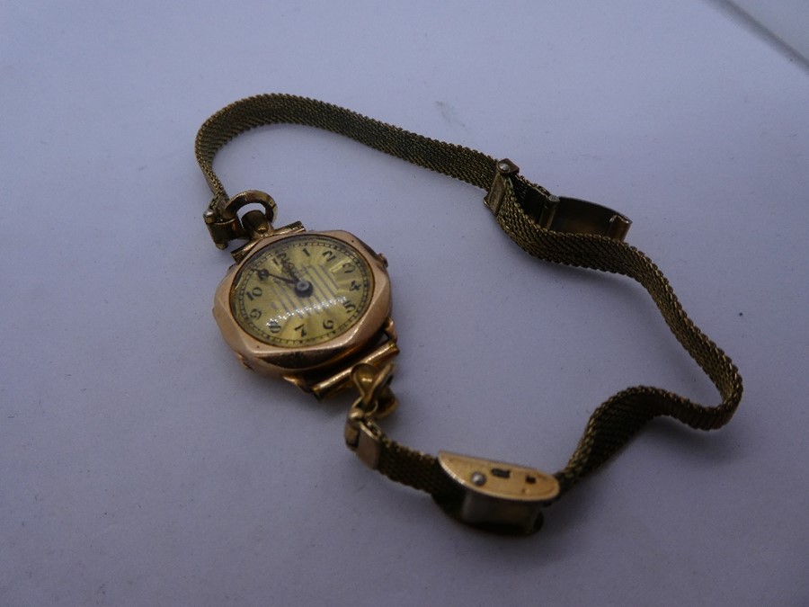 Vintage 9ct yellow gold cased wristwatch by W.Jenkin, marked 375, on a rolled gold strap