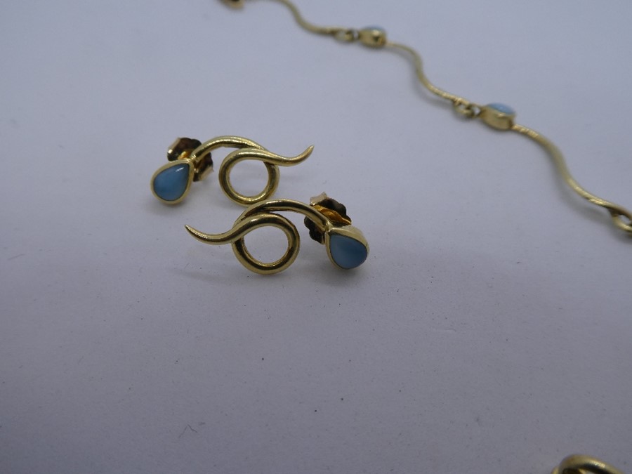 14K Yellow gold 'S' design bracelet set with pale blue stones reputed to be larimar, together with a - Image 3 of 5