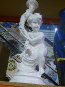 A painted plaster cherub table lamp