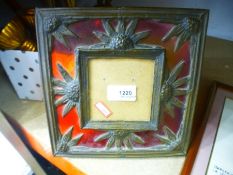 Red stained glass photograph frame decorated withsunflowers and a small box of brass items to incl.