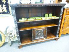 Late 19th Century/early 20th century carved continental oak bookcase with central cupboard on bottom