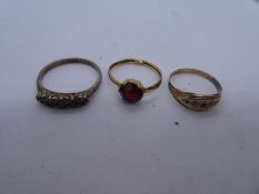 9ct Yellow gold dress ring set with a garnet, size O, marked 9ct, approx 1g. Together with an unmark