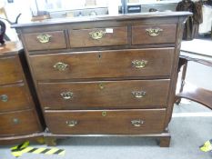 Mahogany chest of drawers with 3 short drawers above 3 long on bracket supports and carved canted co