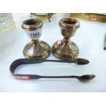 A pair of silver candlesticks hallmarked Birmingham 1975, PH Vogel & Co. Height approx 7cm, toogethe