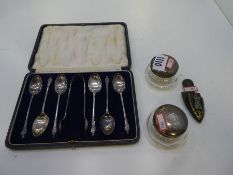 A silver lot comprising of a set of six silver Apostle spoons with matching sugar tongs. Hallmarked