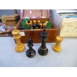 Vintage mahogany case containing wooden chess pieces