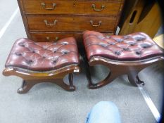 Pair of red leather buttoned footstools on x frames supports