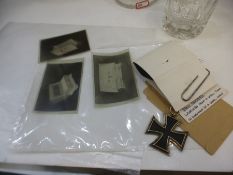 Third Reich Iron Cross with ribbon, together with three large negatives of a Nazi Sarcophagus etc