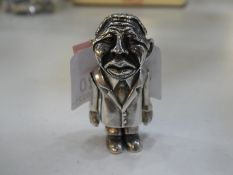 A silver Mandela man of high quality, wearing  a suit and moving ligaments, stamped 925