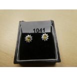 Pair of 18ct white and gold cluster earrings with central yellow sapphire surrounded by diamond chip