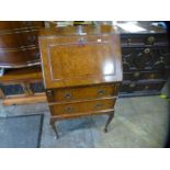 Walnut fitted bureau of small proportions