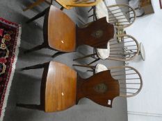 Pair of 19th Century mahogany shield back hall chairs with painted crests to back