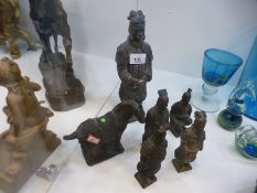 Group of Oriental terracotta figures of Japanese warriors and a horse