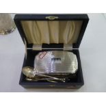 A silver lot comprising of a cased sterling silver topped dressing table brush and comb hallmarked B