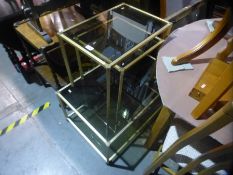 Nest of 3 brass and smoked glass coffee tables