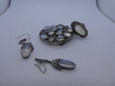 Art Deco style white metal dress ring with central oval moonstone surrounded by seed pearls, matchin