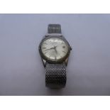 Vintage gents stainless steel wristwatch by Trident, winds and ticks