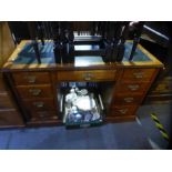 Vintage mahogany kneehole desk with 9 drawers and green leather insert