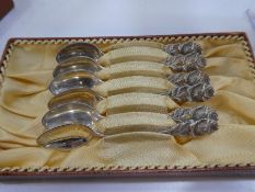 Set of silver German teaspoons with pierced rose handles, marked 800, approx weight 1.96ozt