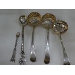 A silver lot comprising of various spoons. Ornate and decorative design. One white metal. Total gros